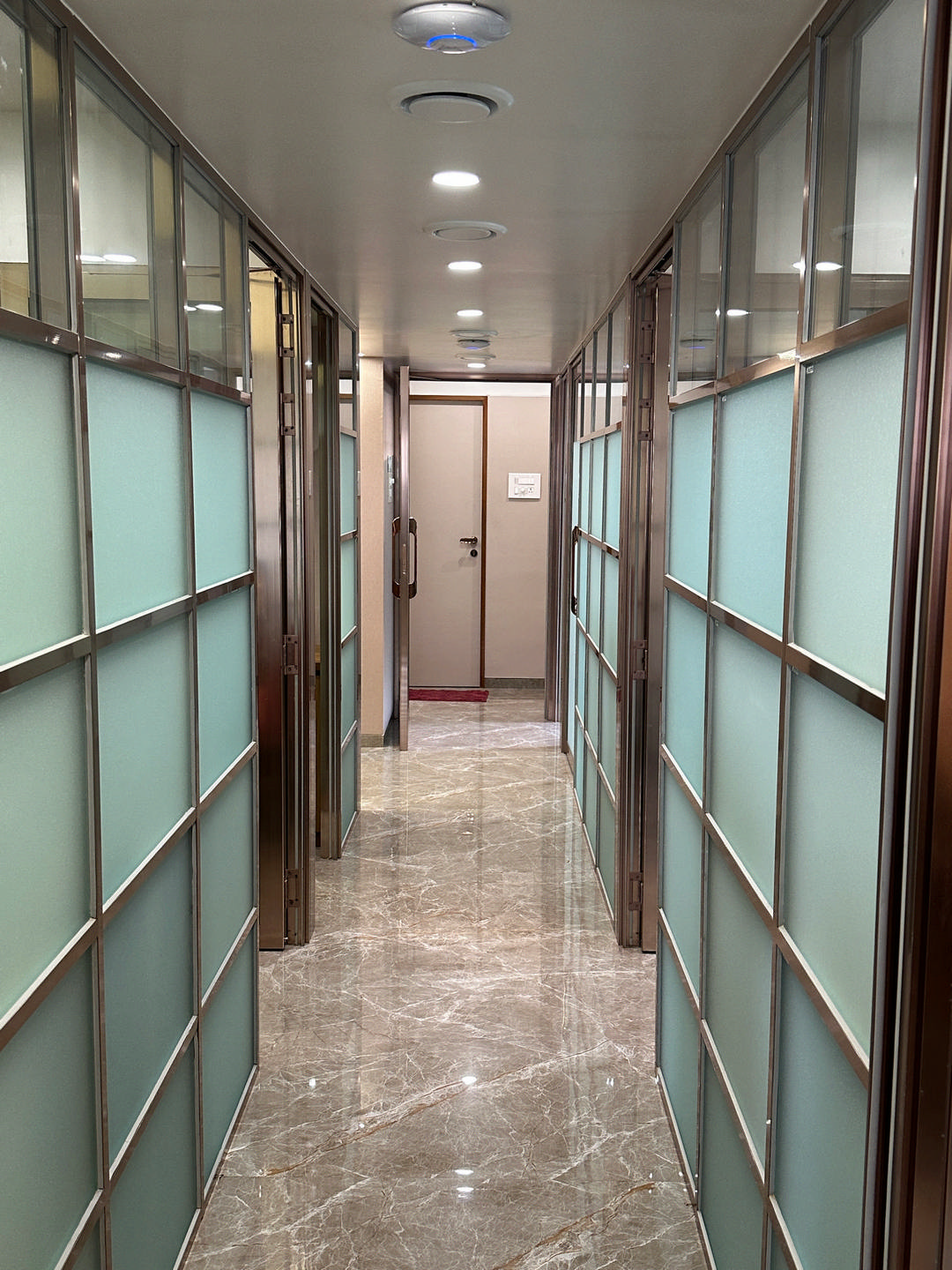 Installed glass partition with wood framing